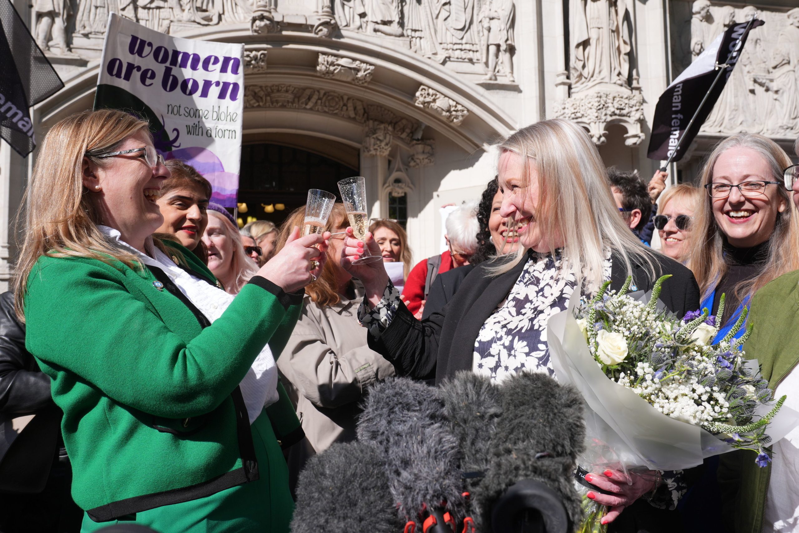 Susan smith (centre left) and Marion Calder (centre right) co-directors of For Women Scotland with campaigners celebrate outside the Supreme Court in London after terms "woman" and "sex" in the Equality Act refer to a biological woman and biological sex, the Supreme Court has ruled.
